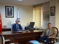 Başkan Can, Rektör Uzun’u Kumluca’ya davet etti